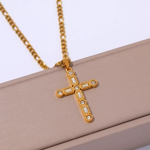 Detailed macro view of 18k gold plated titanium steel cross necklace with crystals