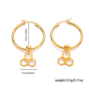 Detail view of gold hoop earrings with honeycomb pendants and dimensions 2.8cm in diameter