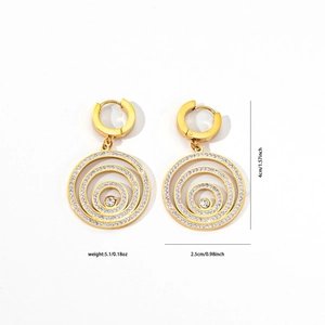 Macro view of gold-plated concentric circle earrings with sparkling rhinestone pavé setting