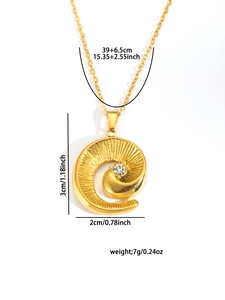 Detail view of a gold spiral pendant necklace with a clear gemstone on white background