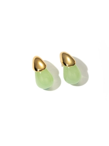 Detail view of pear-shaped light green resin earrings with polished gold metal finish