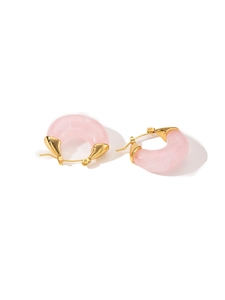 Detail of pink resin hoop earrings with elegant gold metal clasp and simple design