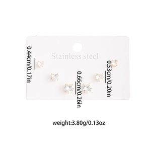 Three pairs of heart-shaped stainless steel earrings with white cubic zirconia in gold plating