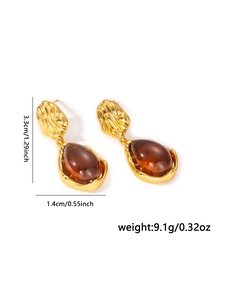 Detail showing retro gold drop earrings with dimensions of 3.3cm length and 1.4cm width