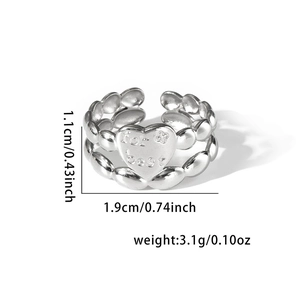 Detail of silver heart ring with for best engraving and beaded band design
