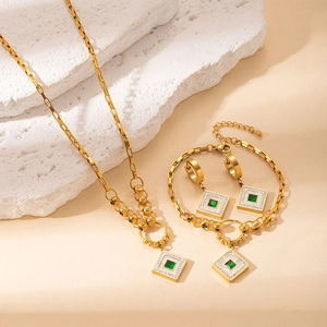 Vintage gold plated stainless steel jewelry set with emerald green square stones