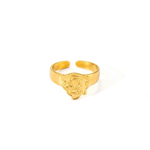 Bague ouverte en acier titane doré avec design en relief de tête de lion abstraite