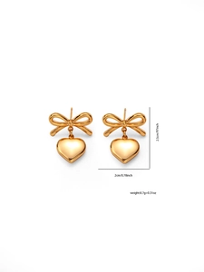 Golden bow heart drop earrings showing 2.5cm height and 2cm width product dimensions