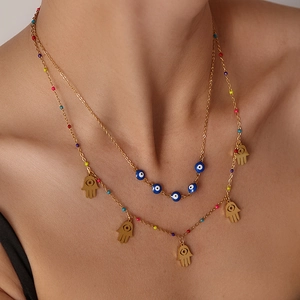 Double-layered gold titanium steel necklace with Hamsa Hand and Evil Eye charms