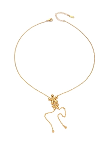 Detail of gold titanium steel necklace featuring double flower pendants and tassel chain