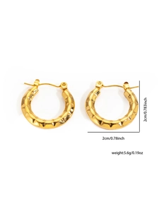 Detailed view of 2cm gold-plated titanium steel hoop earrings with hammered texture