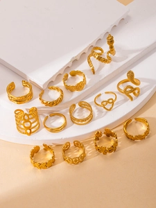 Detailed set of 12 gold titanium steel rings in snake, heart, and leaf designs