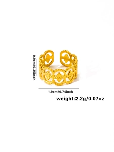 Detail view of gold titanium ring with hollow geometric patterns and dimension measurements
