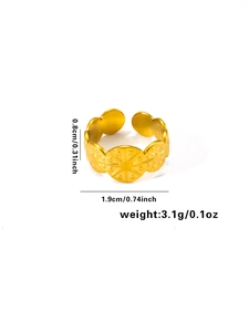 Detailed view of golden stainless steel ring with radial sunburst pattern and measurements