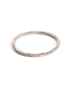 Detailed view of silver titanium steel bracelet with textured patterns and metallic luster