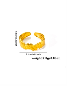 Detailed view of gold twisted titanium ring with 0.6cm width and adjustable opening