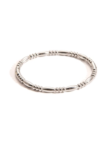 Detailed macro view of polished silver titanium steel bracelet with oval metal beads