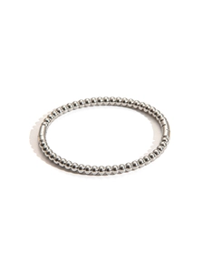 Macro view of polished silver bead bracelet with invisible side pressure clasp detail