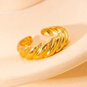 Polished gold croissant dome ring with elegant spiral twist and adjustable open design