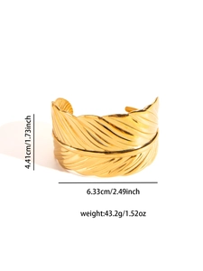 Detailed view of golden feather cuff bracelet showing precise size and weight metrics