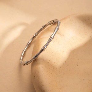 Minimalist silver titanium steel bamboo design bangle with polished metallic finish