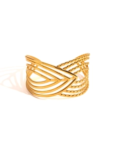 Detail of gold multilayer open cuff bracelet with geometric lines and bead textures
