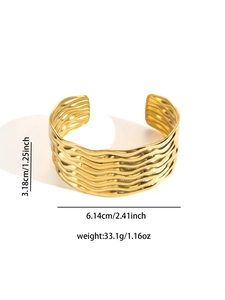 Detailed view of gold stainless steel bangle with wavy texture and size measurements