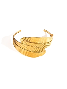Detailed close-up of golden feather-shaped open bangle with intricate texture
