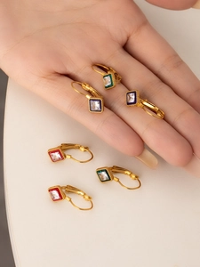 Detailed shot of vintage style 18K gold plated square earrings in red, green and blue