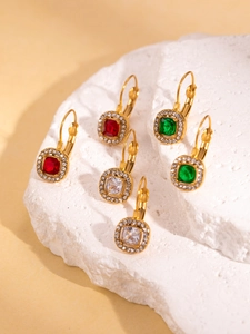 Close-up of vintage 18K gold plated lever-back earrings with colorful gemstones