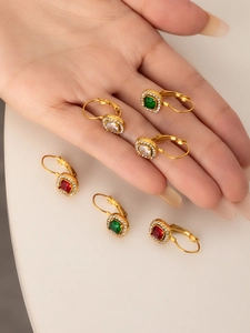 Detail shot of vintage 18K gold plated earrings with colorful square zircons