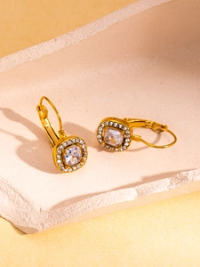Detail of 18K gold plated leverback earrings with square halo and clear gemstone
