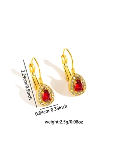 Detail view of pear-shaped red crystal earrings with size measurements in inches and cm