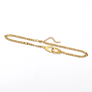 Golden Figaro chain necklace featuring a FREEDOM engraved handcuff pendant for hip hop style