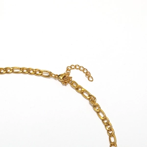Golden Figaro chain necklace in 18k gold plated stainless steel with lobster clasp detail