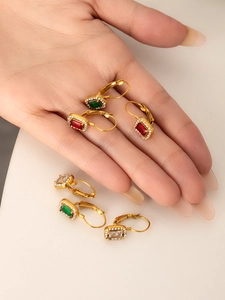 Detailed view of French vintage earrings featuring colorful crystals and 18K gold plating