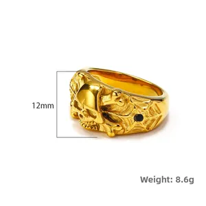 Men's punk skull ring in gold stainless steel with spider web and black stone, 12mm