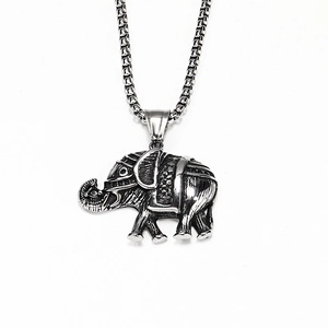 Detail view of retro elephant pendant featuring ethnic patterns and oxidized silver finish