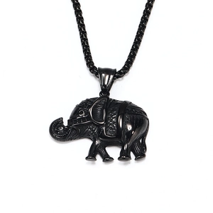 Close-up of vintage black titanium steel elephant pendant with textured details and box chain