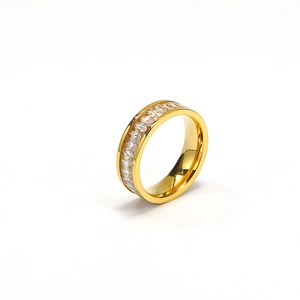 Close-up of gold-plated eternity ring with square-cut sparkling crystals on white background