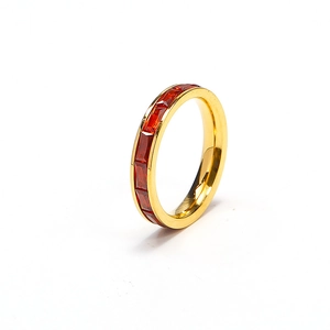 Elegant gold eternity ring with rectangular orange-red zircon stones on white background