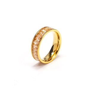 Detail view of gold eternity ring with amber rectangular crystals and polished finish
