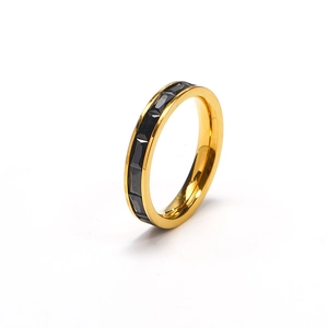 Detailed view of gold plated titanium steel ring with rectangular black zircon stones