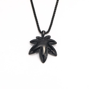 Men's minimalist black maple leaf pendant with a matching black beaded chain necklace