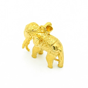 Polished gold elephant pendant necklace in titanium steel with detailed floral engravings