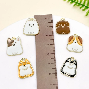 Detailed view of 2cm colorful cartoon dog enamel charms arranged with a scale ruler