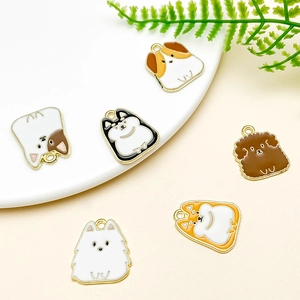 Close-up of six cartoon dog enamel alloy charms with gold metallic hooks for DIY jewelry