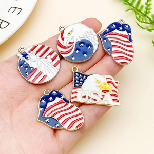 Detail of USA themed enamel eagle and Statue of Liberty charms for DIY jewelry making