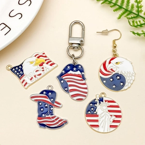 Flat lay of USA themed eagle and Statue of Liberty alloy pendants and keychains