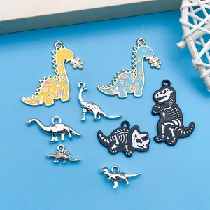 Detailed set of colorful enamel and metal dinosaur charms for DIY jewelry making